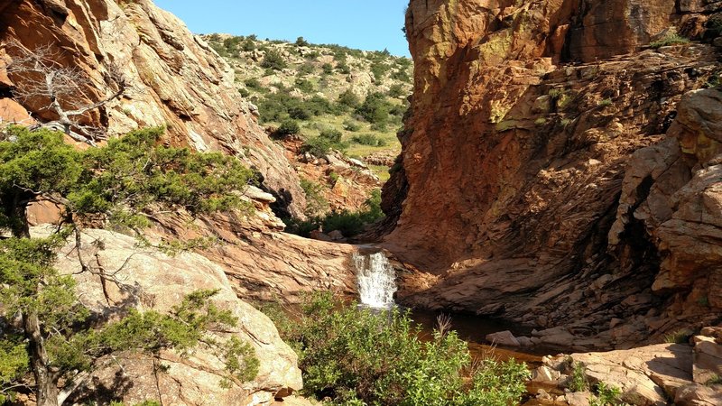 The trail passes up the cut.