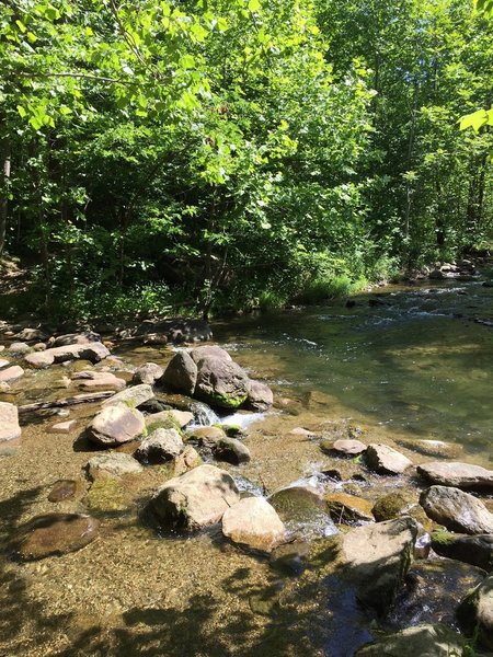 A creek crossing made up of large rocks and boulders.