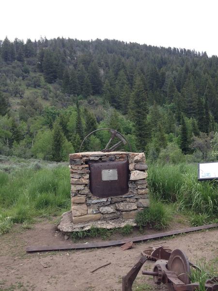 Old equipment and placard describing the sawmill.