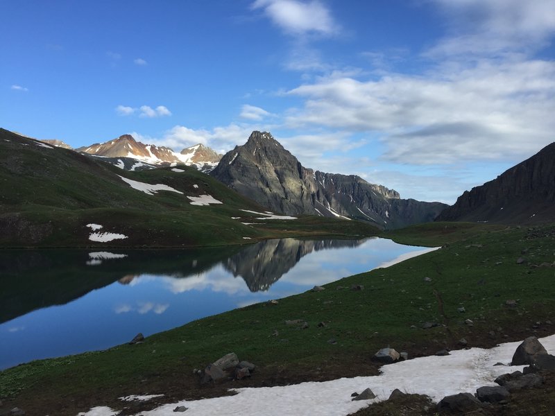 The view across Upper Blue Lake to the Dallas Peak area.