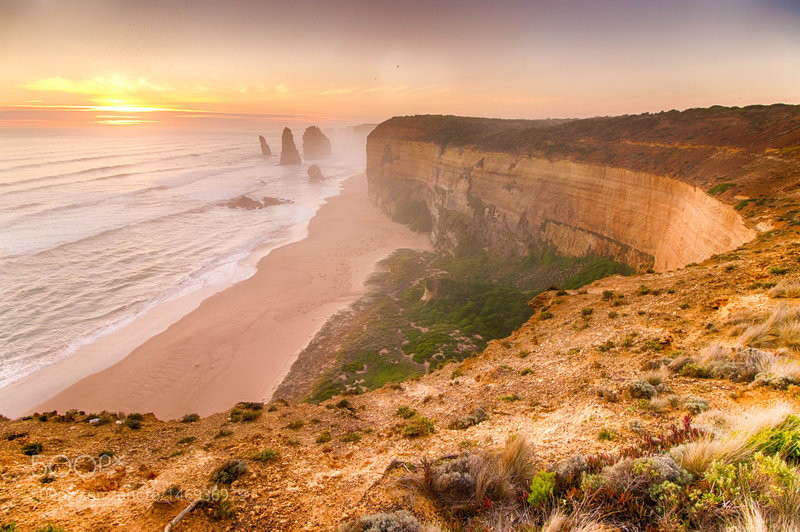 The Twelve Apostles shrouded by ocean spray.