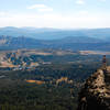 Numerous volcanic ranges ripple away from the southern aspect of Castle Peak.