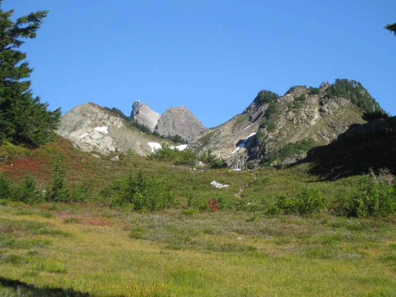 Looking up to the Three Fingers Lookout (middle of 3 left summits) from about Goat Flats.