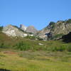 Looking up to the Three Fingers Lookout (middle of 3 left summits) from about Goat Flats.