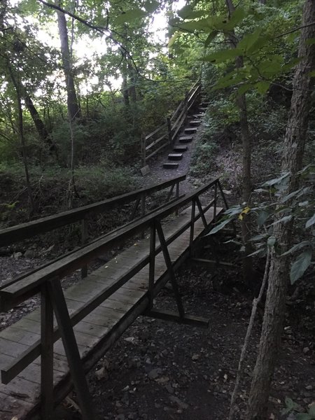 Bridge crossing creek before steep ascent.