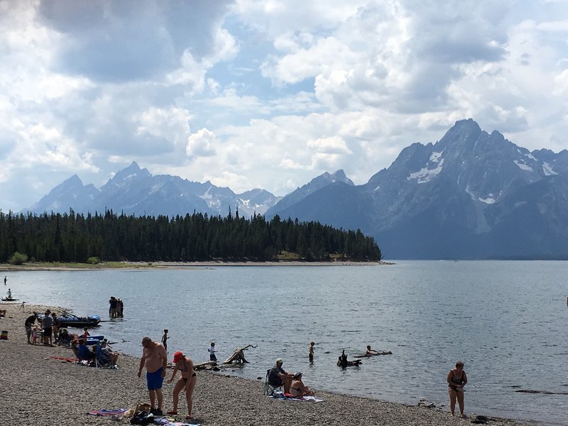 Visitors enjoy Jackson Lake as the Grand Teton defines the horizon.