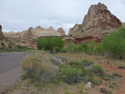 Navajo Dome rising along UT-24 (main pointy formation), Capitol Dome hidden from view in the background to the right.