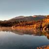 Pike's Peak reflects off of the placid water in the early morning light.