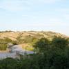 The trail rises above the parking lot offering some of the best views of the Open Spaces in the areas.