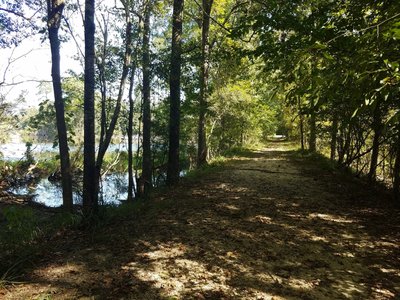 Nice wide trail starting off on a land bridge between two bodies of water.