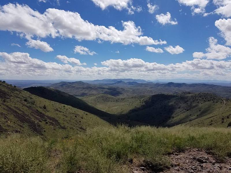 A beautiful view of the distant mountains close to the top of the peak.