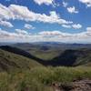 A beautiful view of the distant mountains close to the top of the peak.