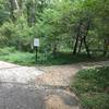 South Run Stream Valley Trail - main trail turns right. Trail changes from paved doubletrack to paved singletrack.