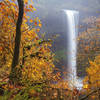 South Falls framed by fall foliage.