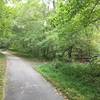 Main trail continues straight ahead. Bridge crosses South Run stream.