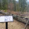 Interpretive sign and sluice box.