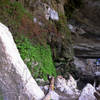 Trail under the overhanging cliffs that round Hamilton Pool