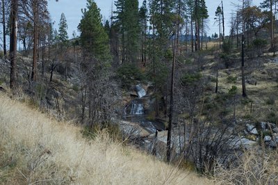 From the trail, you can see several cascades and pools in Cane Creek above the falls.