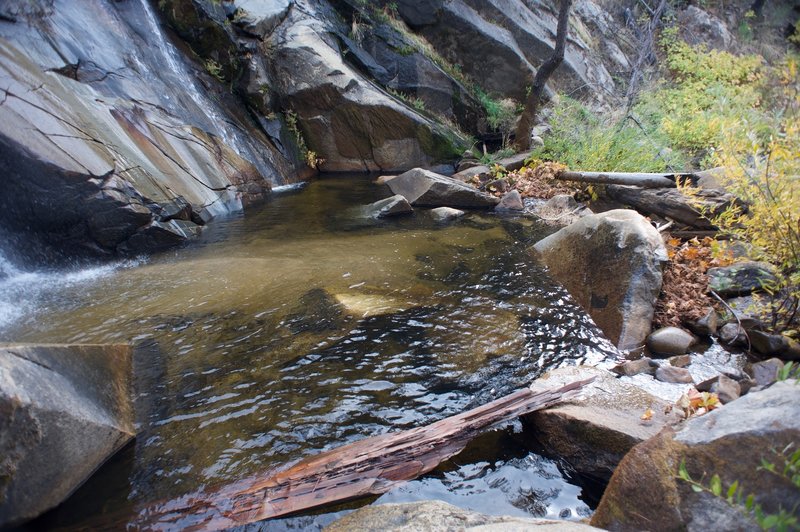 The pool below the falls before it crosses under the bridge.