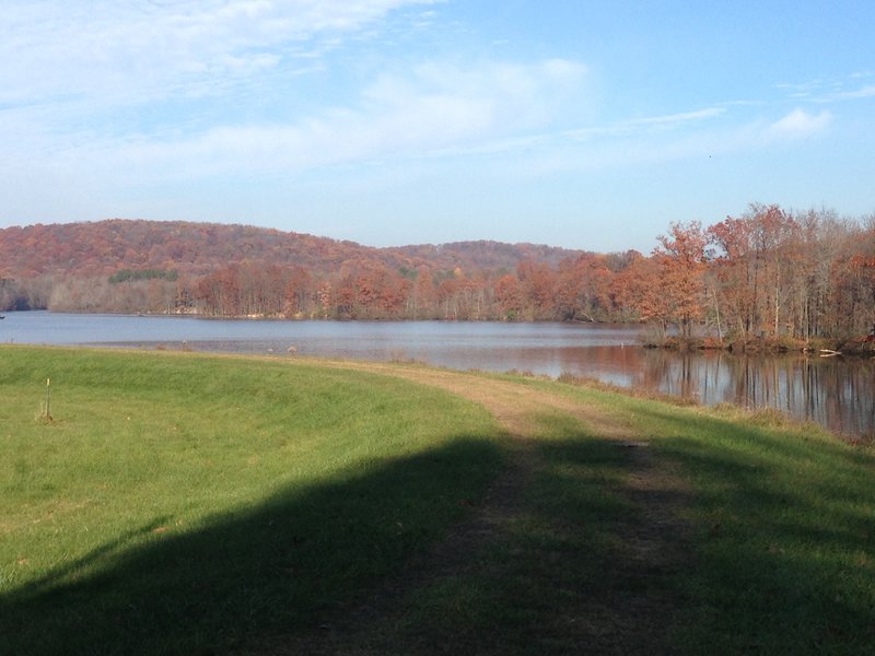 Grass field at the top of the dam along North Country Trail. Great view of Lake Arthur.