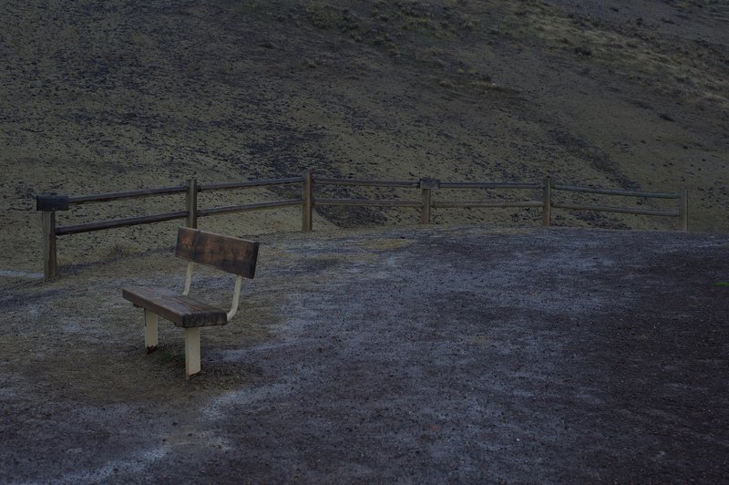 At the end of the trail, there is a bench where you can take in the view. The fence prevents people from damaging the surrounding hills.