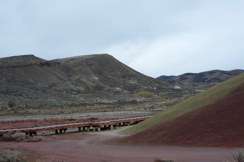 The trail comes back to the boardwalk and parking area, with views of Carroll Rim park and other hills in the distance.