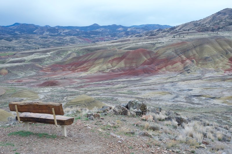 A bench sits off to the right side of the trail, allowing you to take in the views of Painted Ridge and the surrounding hills.