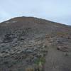 The trail climbs to the top of this hill.   You can also see the box that contains the trail ledger off to the right.