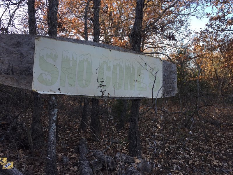 You'll go down a hill, around a bend and then up a short hill where you'll see the snow cone sign (the weather has not been a friend of the sign).