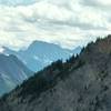 A zoomed-in view to the south displays Mount Assiniboine in the distant center.