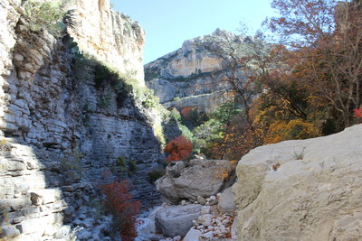 Towering rocky cliffs stand as sentinels guarding the entrance to Devil's Hall.