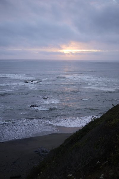 A California Sunset, admired from the rocky shores of Enderts Beach.