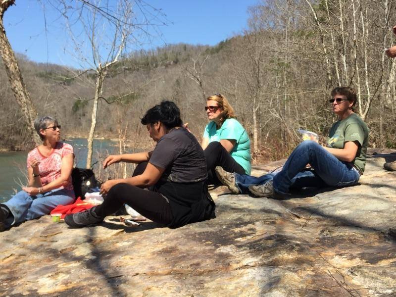 Hikers enjoy a snack by the Big South Fork Cumberland River.