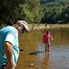 Hikers enjoy the boat launch area in the summer heat at the Blue Heron Outdoor Museum along the Blue Heron Loop Trail.