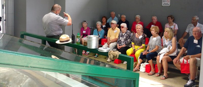 Visitors take in a ranger-guided program at the Big South Fork NRRA Blue Heron Outdoor Museum.