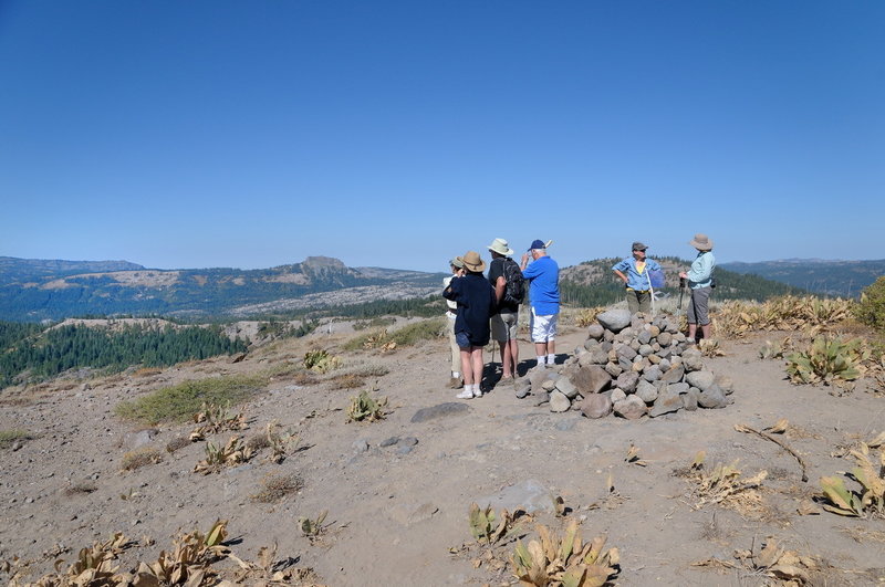 Hikers enjoy the view at the top of Rowton Peak along the Razorback Ridge Trail.