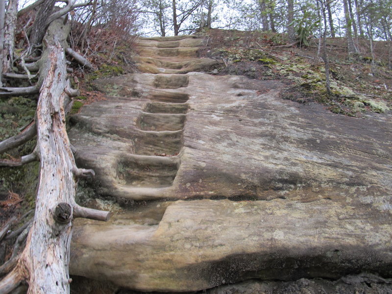 A carved-rock staircase leads to the top of Double Arch.