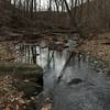 The Turkey Hill Trail heads through a stream crossing before making a steep ascent.