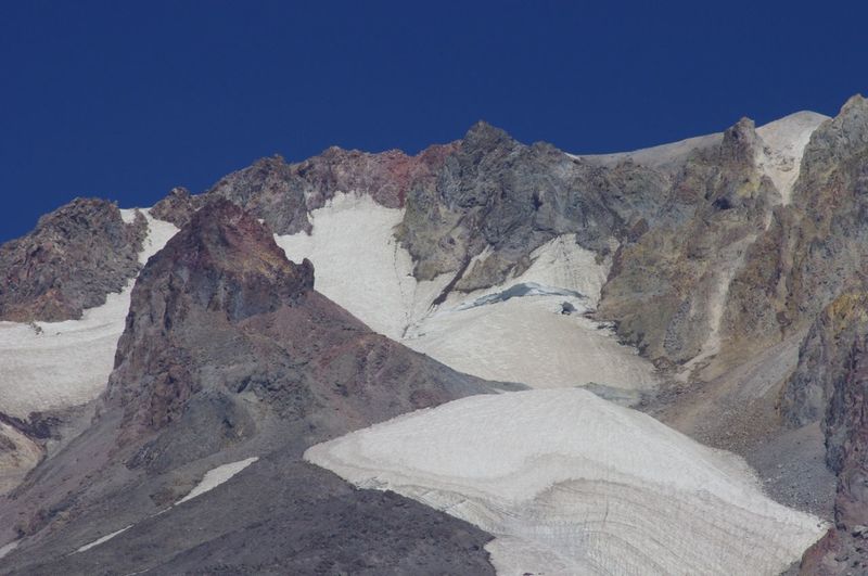 Crater Rock (foreground) and the Bergschrund Crevasse can be seen from the Mountaineer Loop Trail. Photo by John Sparks.