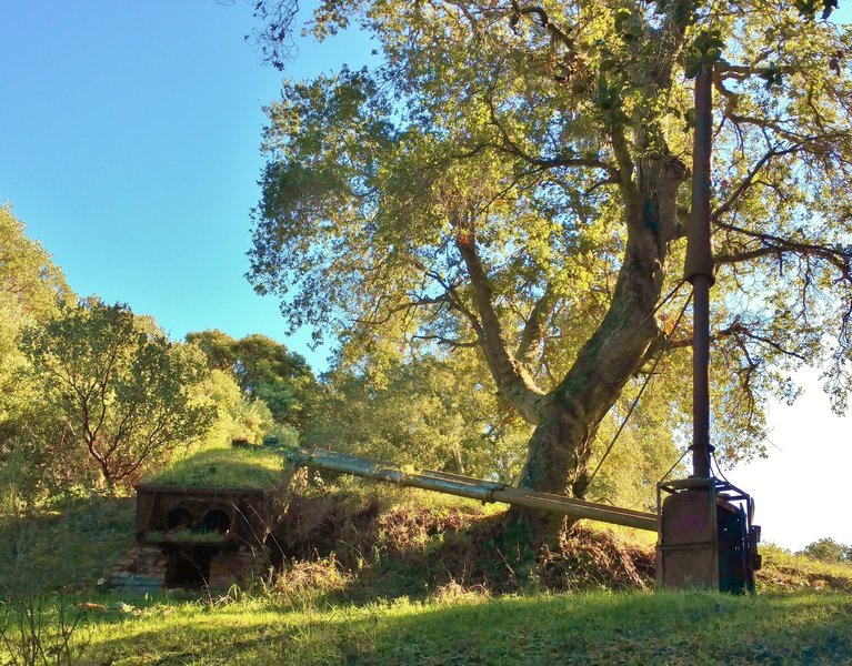 A piece of old mining equipment clutters the otherwise-beautiful site of the old Enriquita Mine.