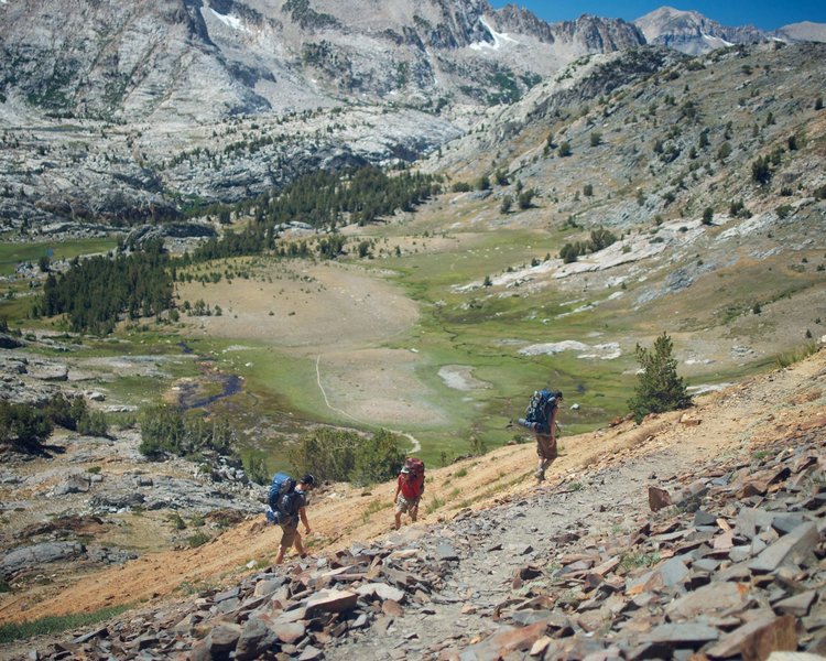 A group of backpackers cruises switchbacks on McGee Pass.