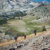 A group of backpackers cruises switchbacks on McGee Pass.