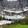 Iceberg Lake pools in the midst of a colossal cirque in Glacier National Park.