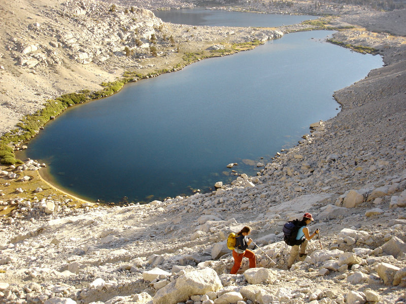 A pair of hikers climbs from the Cottonwood Lakes up Old Army Pass in Sequoia National Park.