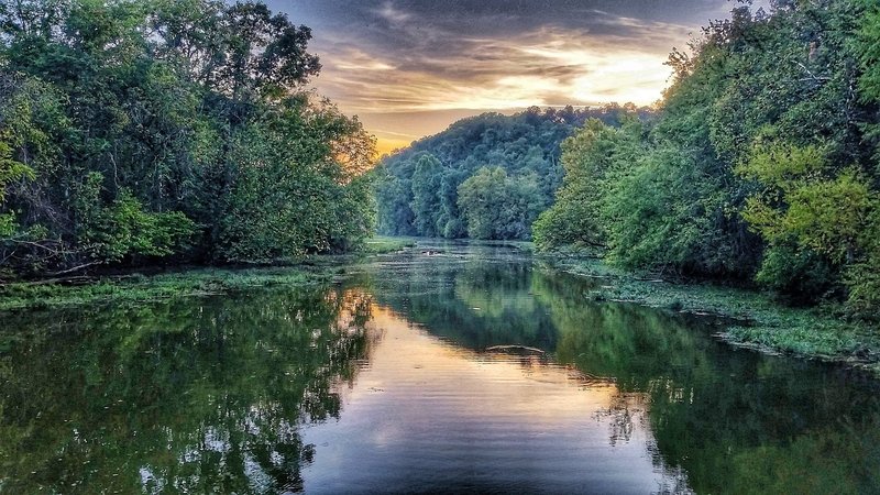 A sunset offers a beautiful backdrop to the meandering waters of the James River.