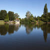 Turtle Lake glimmers peacefully in the center of Hamilton Gardens.