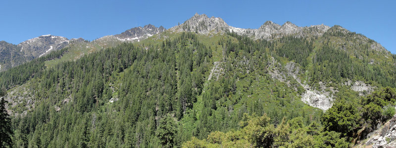 Tall evergreens line the canyon along the Canyon Creek Lakes Trail.