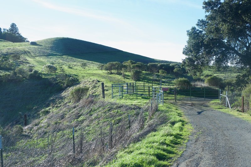 The gate system indicates the end of the preserve and allows you to enter the Mindego Hill area. There are 3 gates you have to go through. You can see the trail breaking around the hill in the distance.