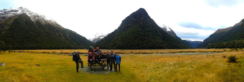 Our group poses outside Flats Hut with Conical Hill serving as the backdrop.