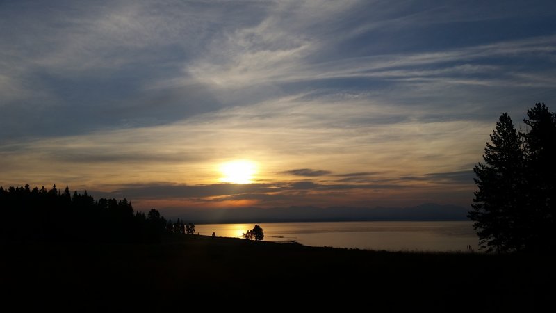 Yellowstone Lake erupts in an orange afterglow at the end of each day.